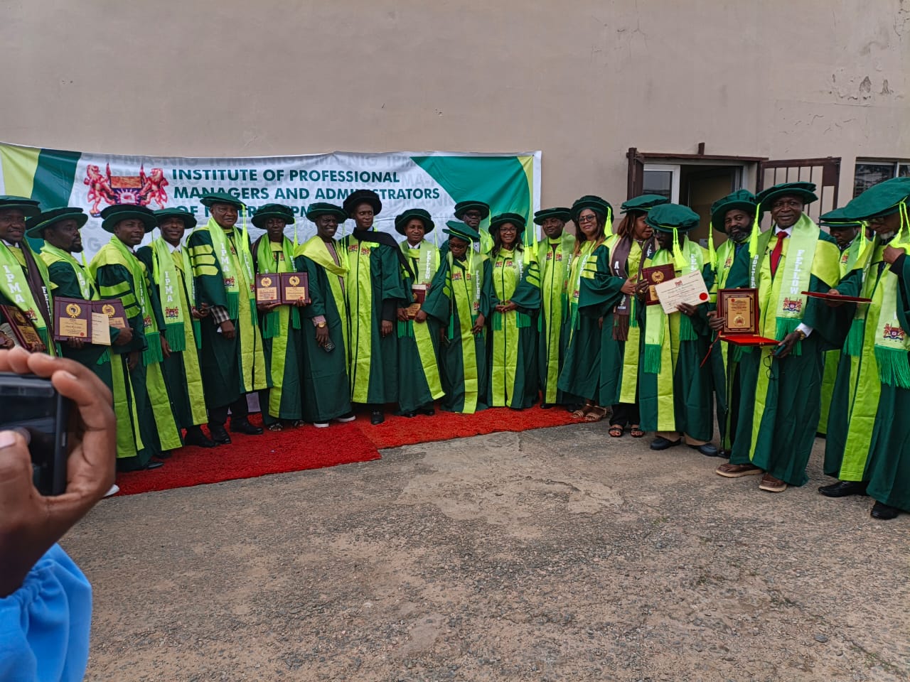 Newly inducted IPMA Nigeria members in ceremonial gowns at the induction ceremony