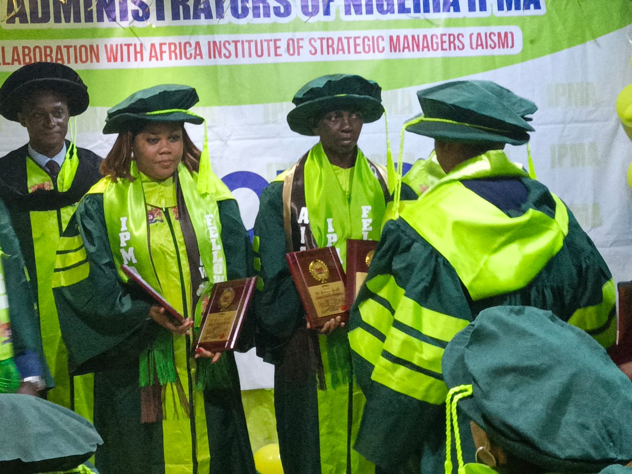 IPMA Nigeria fellows receiving award plaques on stage